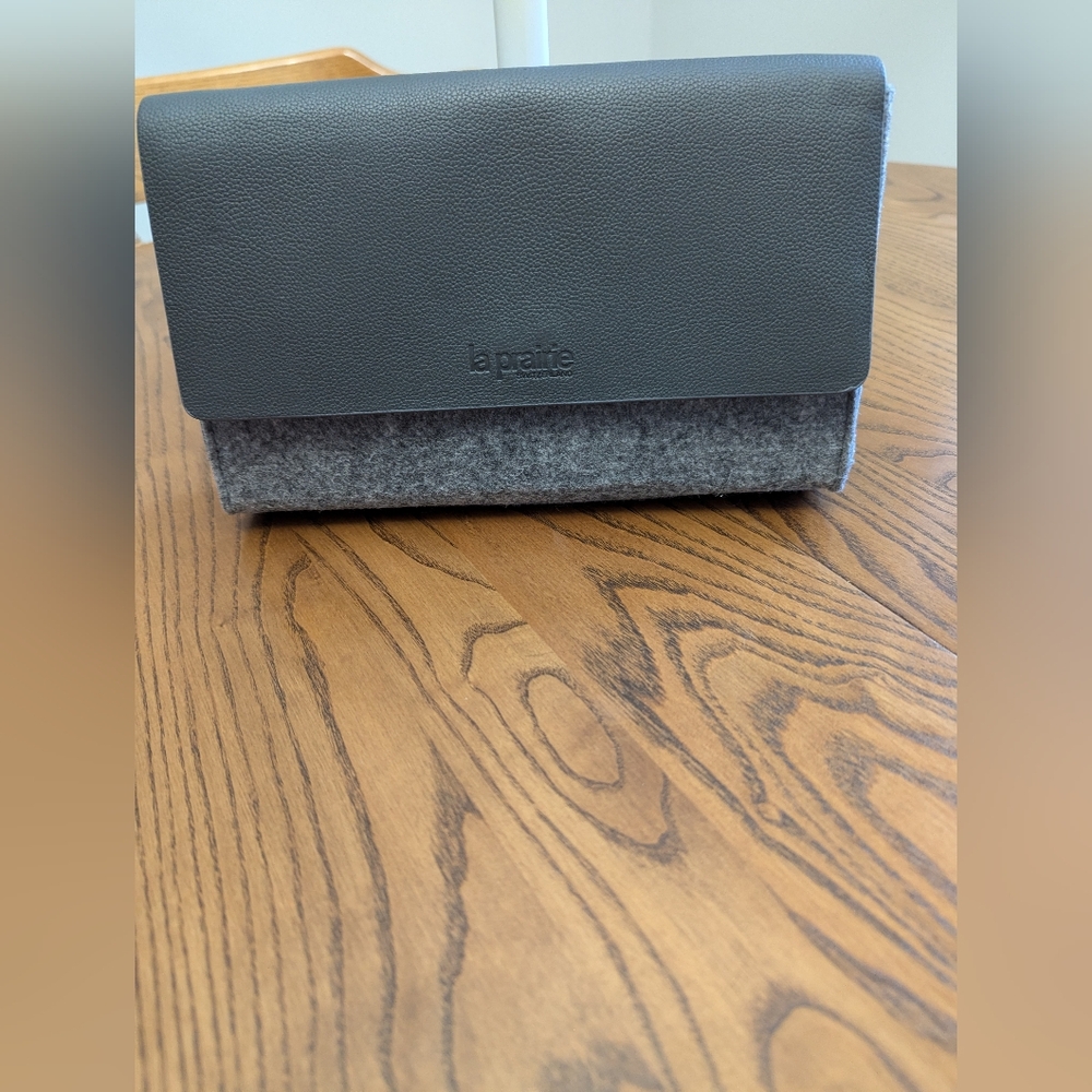 La Prairie Grey Makeup Bag. Flap Cover, Zippered, Medallion Zip Pull. Felted.